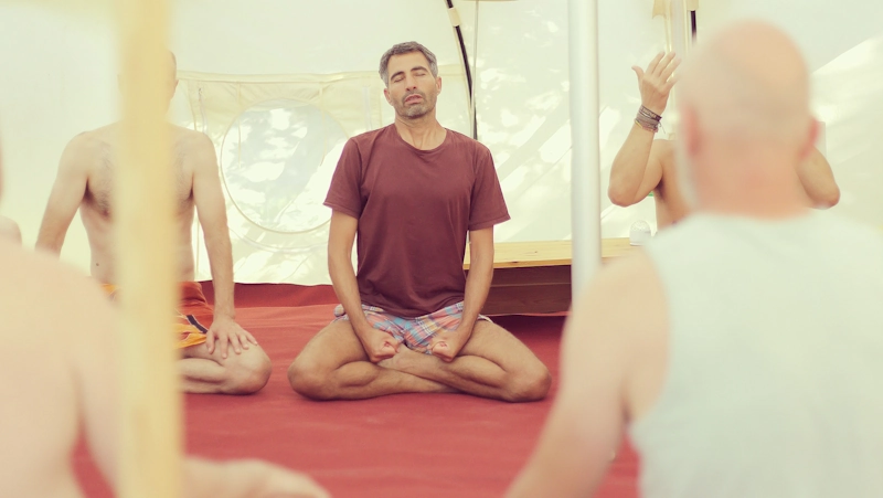 Moshe guiding men in a group workshop on multiple orgasms